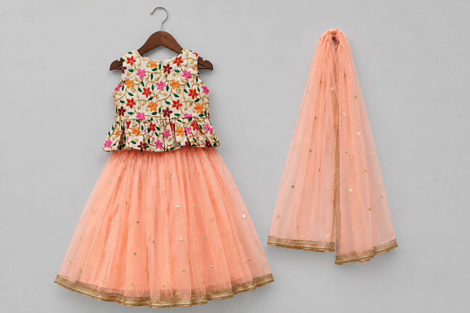 Girls Floral Embroidered Peplum Top with Peach Net Lehenga Set